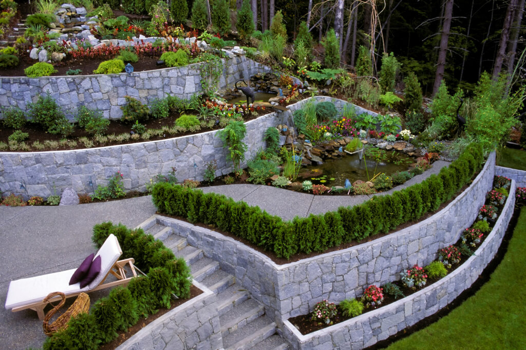 A stone retaining wall in a landscaped garden in Nashville